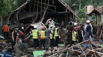 Rescuers look for survivors along the coast in South Lampung. AFP