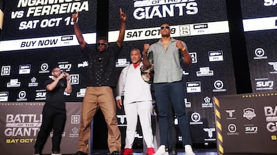 Francis Ngannou and Renan Ferreira pose on the stage in Riyadh. Chris Whiteoak / The National