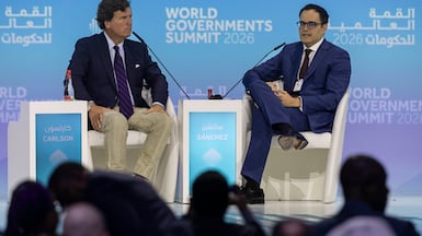 Calixto Ortega Sanchez, Venezuela's Vice President for the Economy, right, and political commentator Tucker Carlson in Dubai. Antonie Robertson / The National