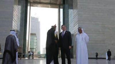 Gordon Brown, the British prime minister, centre, arrives at the Dubai International Financial Centre (DIFC), with Dr Omar bin Sulaiman, left, the governor of DIFC, and Sultan bin Saeed al Mansouri, right, the Minister of Economy.