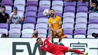 Matthew Jurman of Australia is tackled by Mousa Suleiman of Jordan. EPA