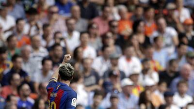 FC Barcelona’s Lionel Messi celebrates scoring against Valencia. Manu Fernandez / AP Photo