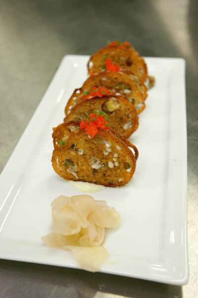 Togarashi crisps with tuna tartare, wasabi, ginger and Tosa soy by chef Wolfgang Puck. Photo: Jaime Puebla for The National
