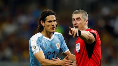The referee Anderson Daronco (R) talks to Edinson Cavani (L) of Ururguay during the Copa America 2019 Group C soccer match between Uruguay and Ecuador, at the Mineirao Stadium in Bello Horizonte, Brazil. EPA