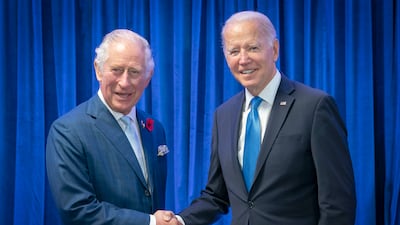 King Charles III, who was Prince of Wales at the time, greets US President Joe Biden at the Cop26 summit in Glasgow in 2021. AP