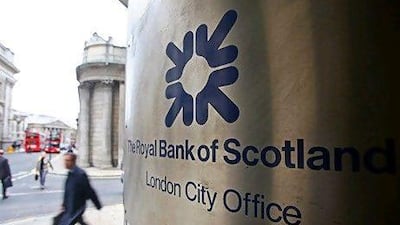 A pedestrian passes a branch of Royal Bank of Scotland in London. While the UK financial institutions face a challenging year they may fare better than their European counterparts. Chris Ratcliffe/Bloomberg