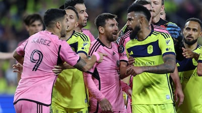 Inter's Luis Suarez and Lionel Messi argue with Anibal Godoy of Nashville. Getty Images