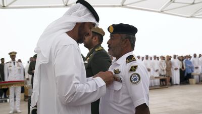 Sheikh Mohammed bin Zayed awards a member of the UAE Armed Forces with a Medal of Bravery for his service in Yemen. Mohammed Al Hammadi / Crown Prince Court.