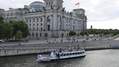 An excursion boat passes the German parliament Bundestag building on the Spree in Berlin, Germany, 12 July 2020 EPA