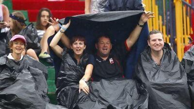 Fans in the rain at The Sevens stadium, Dubai on the 30th November 2012. Jake Badger for The National