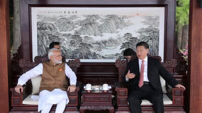 Indian Prime Minister Narendra Modi and Chinese President Xi Jinping talk during a meeting in Wuhan in central China's Hubei Province. Pang Xinglei / Xinhua / AP