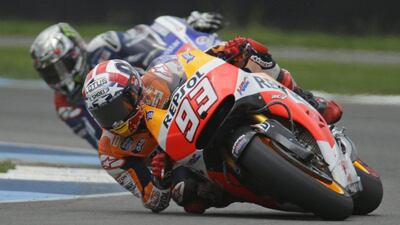 Marc Marquez, of Spain, leads Jorge Lorenzo, of Spain, on his way to winning the Indianapolis Moto GP motorcycle race at the Indianapolis Motor Speedway in Indianapolis, Sunday, Aug. 10, 2014. (AP Photo/Michael Conroy)