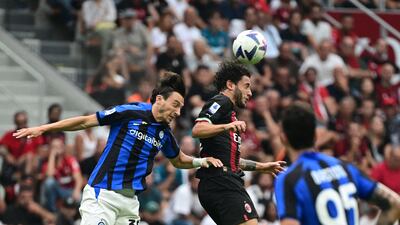 Inter Milan defender Matteo Darmian competes for a header with AC Milan defender Davide Calabria. AFP