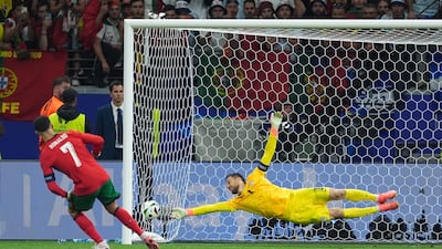 Cristiano Ronaldo scores Portugal's first penalty in the shoot-out. PA