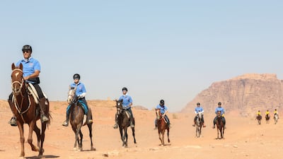 Horse riders take part in 'Gallops', an orienteering and endurance equestrian race, in Jordan's Wadi Rum desert.