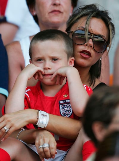 Brooklyn Beckham with his mother Victoria Beckham in 2004. Brooklyn grew up in the spotlight thanks to his famous parents' celebrity status. Getty Images