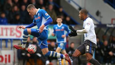 Jimmy McNulty of Rochdale controls the ball against Bury's Leon Clarke during their FA Cup second round match on Sunday. Alex Livesey / Getty Images