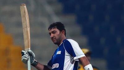 Hasan Raza celebrates after reaching his half century. Courtesy Abu Dhabi Cricket Council