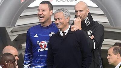Manchester United manager Jose Mourinho, centre, is greeted by Chelsea’s John Terry. Facundo Arrizabalaga / EPA