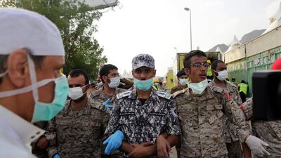 Members of Saudi Arabia's security services block the site of Thursday's stampede in Mina, five kilometres from Mecca, following the tragedy. Amel Pain/EPA