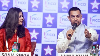 Bollywood superstar Aamir Khan and Sonia Singh, editorial Director of NDTV, attend the FICCI Frames 2015 conference at Hotel Renaissance. Subhash Sharma for The National