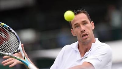 France's Michael Llodra and eight other players retired in the second round. Adrian Dennis / AFP