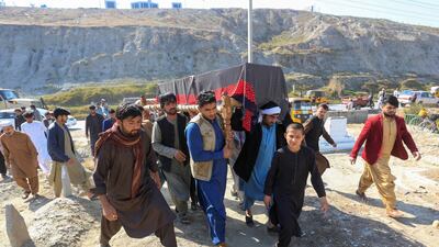 Afghan men carry the coffin of one of three female media workers who were shot and killed by unknown gunmen, in Jalalabad, Afghanistan March 3, 2021. Reuters.