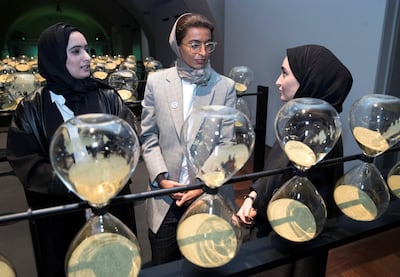 Noura Al Kaabi with Tinkah founders Reem al Ghaith (left) and Kholoud Sharafi at the UAE pavilion. Stephen Lock / The National
