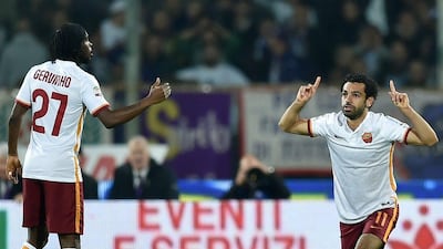 AS Roma's Mohamed Salah celebrates with teammate Gervinho on Sunday during his team's Serie A victory over Fiorentina. Alberto Pizzoli / AFP / October 25, 2015