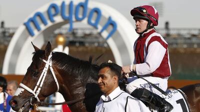 Jockey Sam Hitchcott on his One Man Band leaves after winning the Godolphin race during the Dubai World Cup day horse racing event on March 26, 2016 at the Meydan racecourse in the United Arab Emirate of Dubai. Closing the UAE racing season, the Dubai World Cup day features nine races including the world’s richest horse race, the ten million US dollars Dubai World Cup. / AFP / KARIM SAHIB
