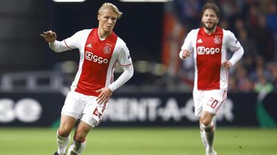 Ajjax striker Kasper Dolberg, left, can often find his Danish compatriot Lasse Schone, right, in proximity when hounding opposition players high up the pitch. Getty Images