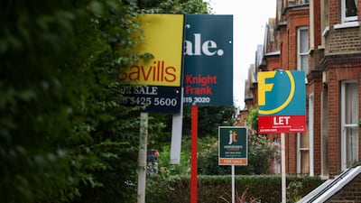 Estate agent "For Sale" and "To Let" signs outside residential properties in London. Bloomberg