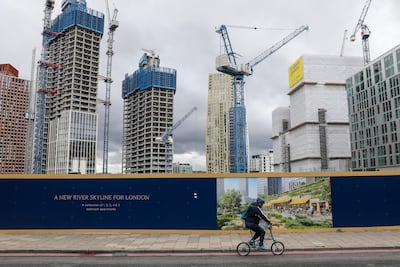 A cyclist passes construction work at the One Thames City development in London. Getty Images