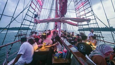 Pets can relax in custom-built 'cat-banas' as their owners enjoy a four or seven-course dinner beside them on deck