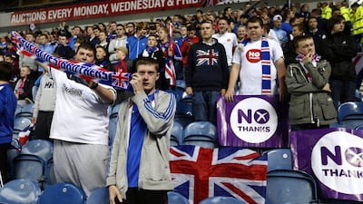 Rangers fans display No Thanks posters during their match against Inverness Caledonian Thistle in the Scottish Premier League on Tuesday. Russell Cheyne / Reuters / September 16, 2014