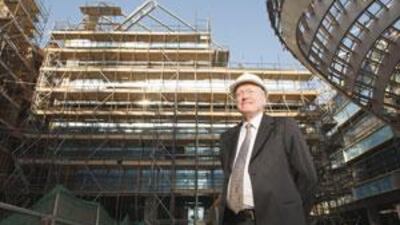 John Perkins is eagerly awaiting completion of the city's first building: the new home of the Masdar Institute for Science and Technology.