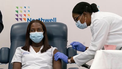 Sandra Lindsay, left, a nurse at Long Island Jewish Medical Centre, became the first person in the US to be vaccinated against Covid-19 on December 14. AP
