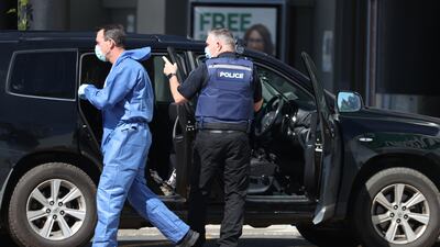 Police forensic staff gather evidence from the Lynn Mall car park in Auckland, New Zealand. Getty Images