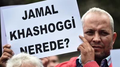 A man holds a placard reading "Where is Jamal Kashoggi ?" during a demonstration in support of Jamal Khashoggi, in front of the Saudi Arabian consulate in Istanbul. AFP