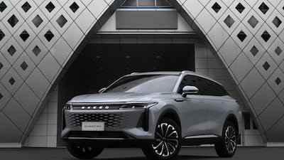 The RX has a futuristic and luxurious look. It features a large grille, swept-back headlights, and a sloping roofline