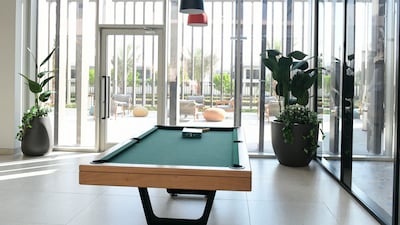 A pool table in the common area of the building