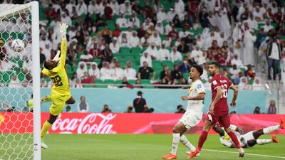 Qatar goalkeeper Meshaal Barsham is beaten by the grounded Famara Diedhiou's header that put Senegal two up. AFP