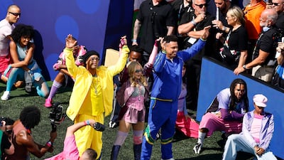 Former Brazil football players Ronaldinho and Ronaldo with Madonna during the halftime show. Reuters