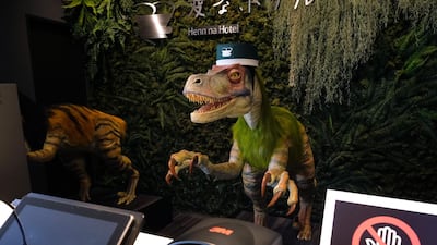 A robot dinosaur wearing a bellboy hats welcomes guests from the front desk at the Henn-na Hotel. AFP