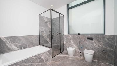 Spacious bathroom facilities, with marble finishing. Courtesy Allsopp and Allsopp