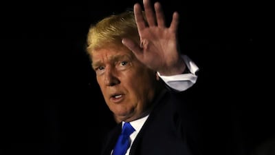 US President Donald Trump waves after arriving in Singapore June 10, 2018. Jonathan Ernst / Reuters Photo