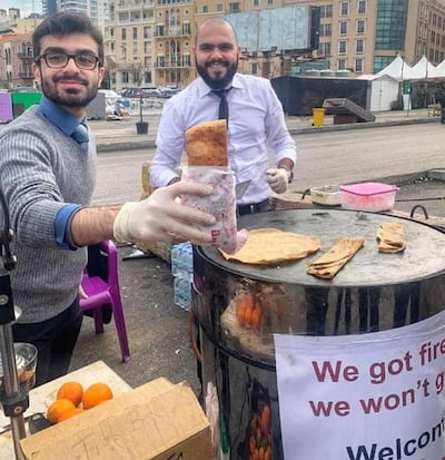 Roudy Hanna, left, and Mark Darido at their streetside saj stand. Courtesy Mark Darido.