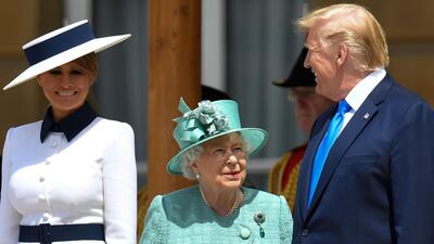 Britain's Queen Elizabeth II (C) speaks with US President Donald Trump (R) as US First Lady Melania Trump (L) smiles during a welcome ceremony at Buckingham Palace in central London on June 3, 2019, on the first day of the US president and First Lady's three-day State Visit to the UK. AFP