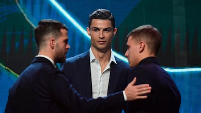 Juventus midfielder Miralem Pjanic, left, Cristiano Ronaldo (C) and Inter Milan midfielder Nicolo Barella pictured after being named in the Gran Gala del Calcio 2019 Best XI. AFP