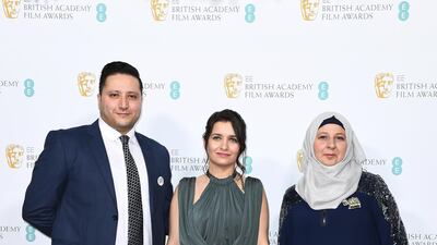 Hamza al-Kateab, Waad Al-Kateab and Afraa Hashem attend the Bafta - EE British Academy Film Awards 2020 Nominees' Party at Kensington Palace on Saturday, February 1. Getty Images